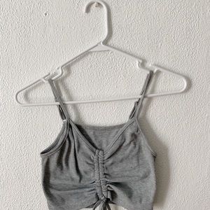 cute gray top with tie in the middle